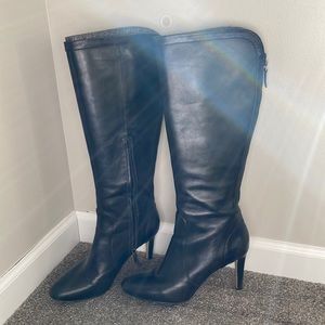 Knee high heeled leather boots